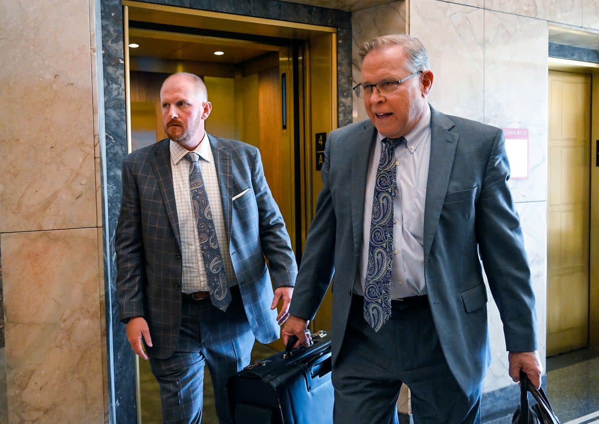 Britt Reid, left, walks to a courtroom with his attorney J.R. Hobbs, right, Tuesday, Nov. 1, 2022, at the Jackson County Courthouse, in Kansas City, Mo. (AP)