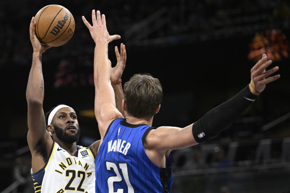 Indiana Pacers forward Isaiah Jackson (22) goes up to shoot as Orlando Magic center Moritz Wagner (21) defends during the first half of an NBA basketball game, Sunday, March 10, 2024, in Orlando, Fla. (AP Photo/Phelan M. Ebenhack)