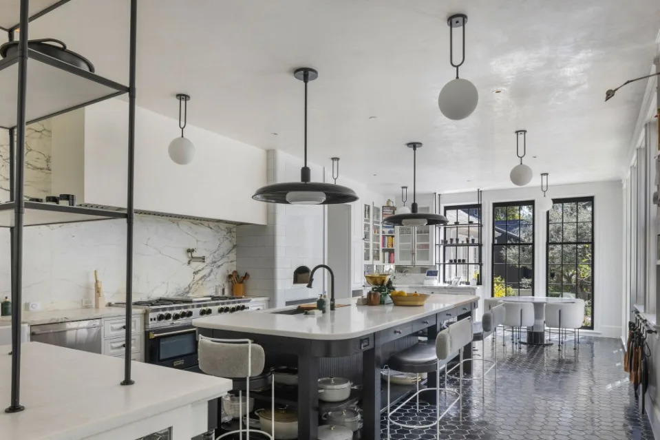 The home’s supersized marble kitchen, where Paltrow frequently films herself cooking, has double cooktops and a wood-burning oven. A. Barcelo/Beverly Hills Estates / MEGA