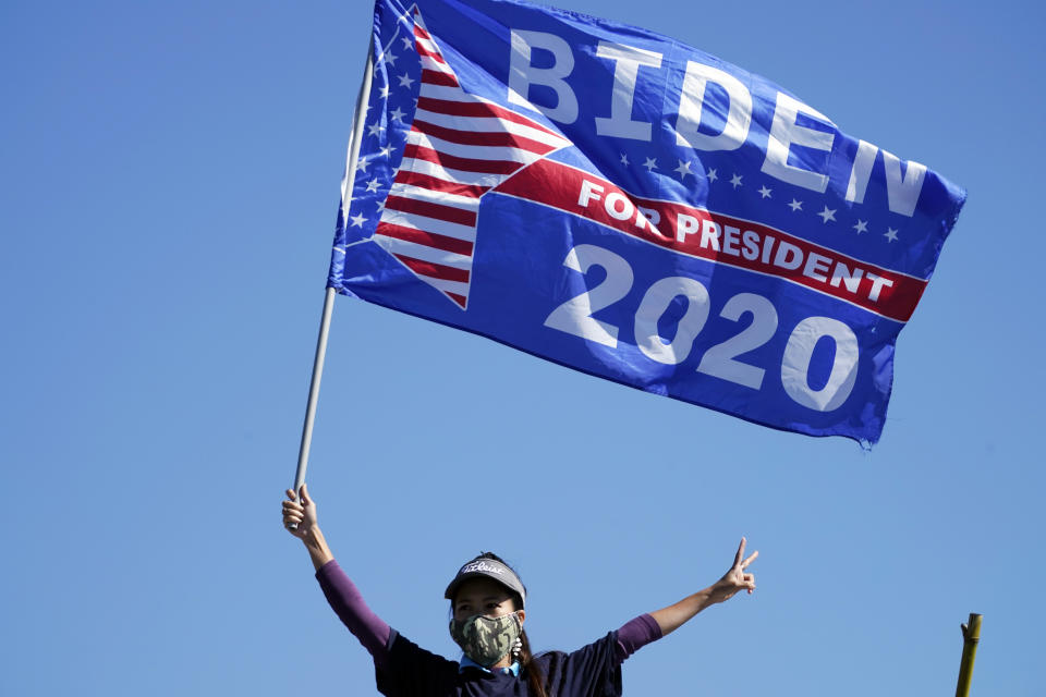 Biden supporters wait for former President Barack Obama to arrive and speak at a rally as he campaigns for Democratic presidential candidate former Vice President Joe Biden, Monday, Nov. 2, 2020, at Turner Field in Atlanta. (AP Photo/Brynn Anderson)