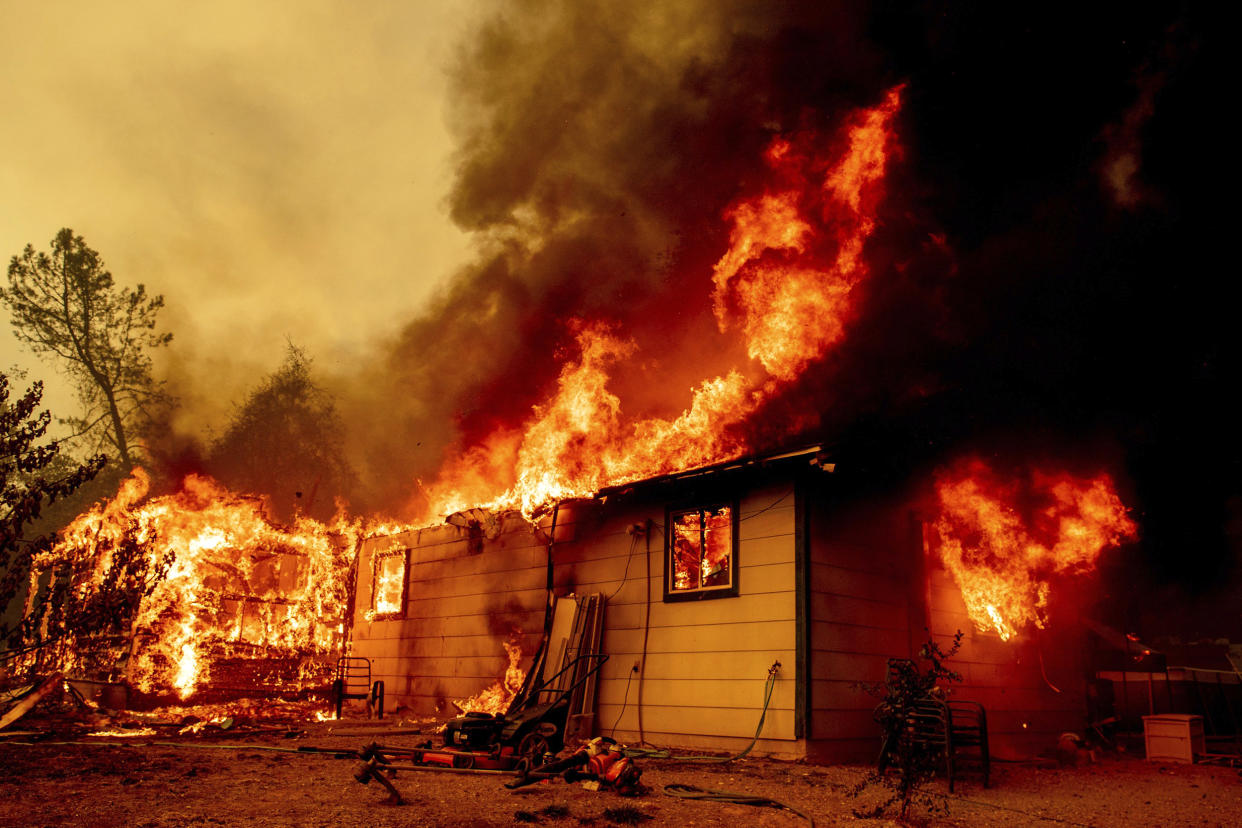 Image: Firefighters battle the Fawn Fire burning north of Redding in Shasta County (Ethan Swope / AP)