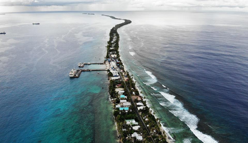 An aerial view of a strip of land between the Pacific Ocean (R) and lagoon on November 25, 2019 in Funafuti, Tuvalu.