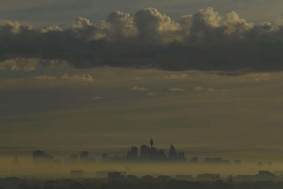 The Sydney CBD is pictured under a smokey haze on Wednesday due to hazard reduction burning in the west. Source: AAP