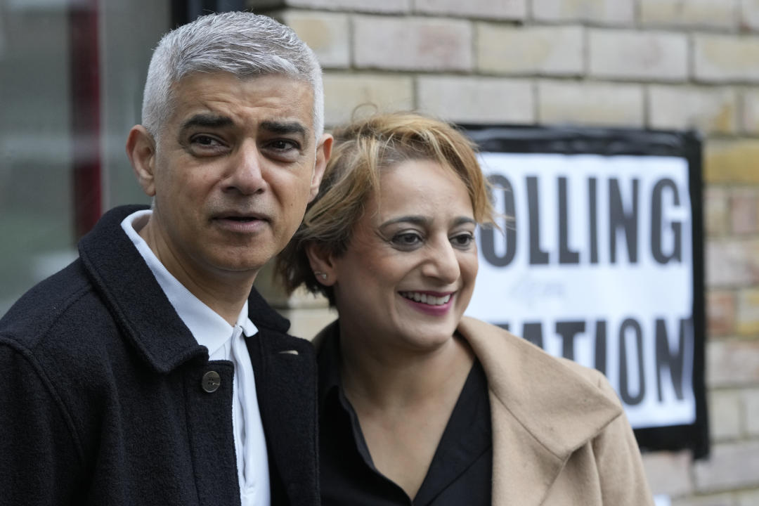 London Mayoral Labour Party candidate Sadiq Khan and his wife Saadiya Ahmed pose for the media as they arrive to vote in London, Thursday, May 2, 2024. Khan, is seeking re-election, and standing against 12 other candidates for the post of Mayor of London. There are other Mayoral elections in English cities and as well as local council elections. (AP Photo/Kin Cheung)