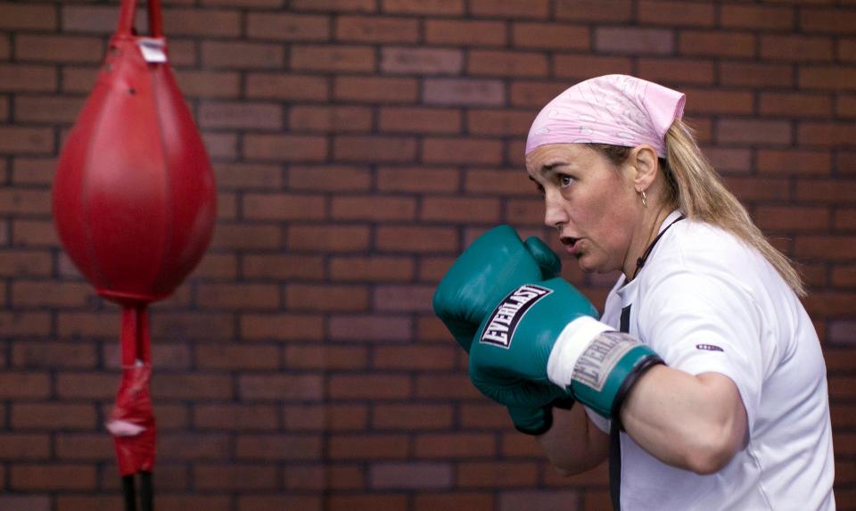 FILE - Boxer Christy Martin works out at the Top Rank gym on Feb. 11, 2011, in Las Vegas. Martin's fight for her life outside the ring, the famous "Malice at the Palace" brawl and Caitlyn Jenner's reflections toward winning an Olympic gold medal are some of the most pivotal sports moments highlighted in a new Netflix docuseries airing next month. The streaming service giant announced Tuesday, July 20, 2021, that the series "UNTOLD" will premiere Aug. 10. (AP Photo/Julie Jacobson, File)