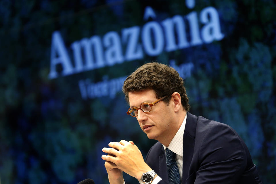 FILE - In this Oct. 9, 2019 file photo, Brazil's Environment Minister Ricardo Salles listens to questions during a meeting of the House of Representatives Environment Committee, in Brasilia, Brazil. Brazilian spending to protect the environment has been sliding for years, and under Jair Bolsonaro the ministry’s budget outlook plunged another 25% in 2021, the lowest level in two decades. (AP Photo/Eraldo Peres, File)