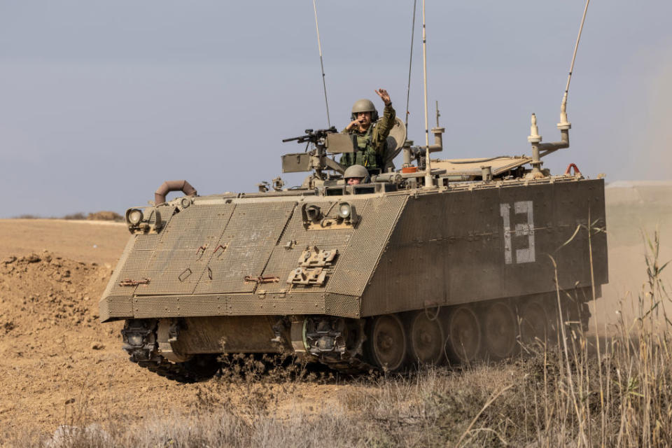 Female Israel soldiers are seen driving an armoured personnel carrier (APC) in southern Israeli.