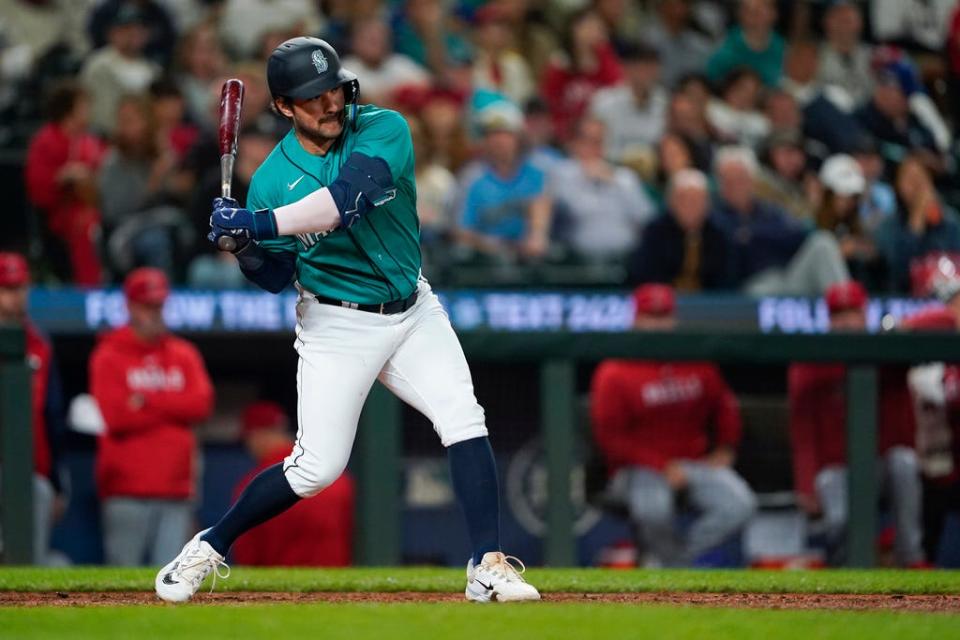 Seattle Mariners' Luis Torrens swings at a pitch in a baseball game against the Los Angeles Angels, Tuesday, Sept. 12, 2023, in Seattle. (AP Photo/Lindsey Wasson)