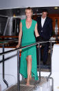 Thurman looks hot in a slinky emerald dress. She kept her look laidback with tossed up hair and nude Louboutin sandals (that she held while disembarking - they’re actresses, not superheroes).