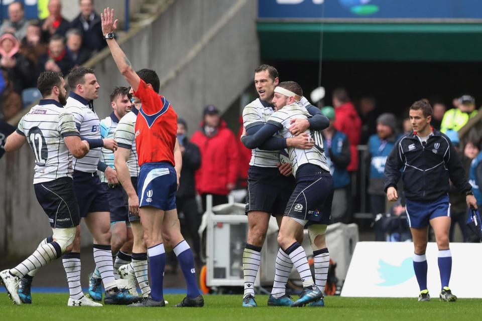 Bonus point: Finn Russel is congratulated by team-mates after scoring Scotland's opening try: Getty Images