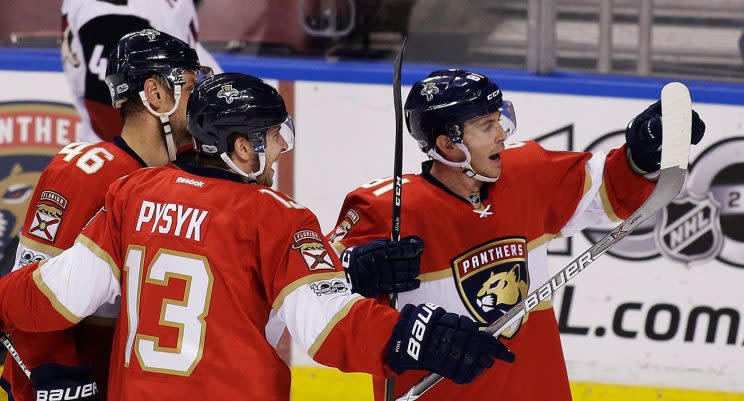 Florida Panthers center Jonathan Marchessault (81) celebrates with teammates, Mark Pysyk (13) and Jakub Kindl (46) after scoring a goal during the second period. (Terry Renna/AP)