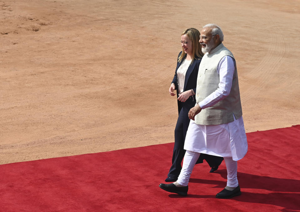 Italian Premier Giorgia Meloni, left, is received by Indian Prime Minister Narendra Modi, as she arrives for a ceremonial reception at the Indian Presidential Palace in New Delhi, India, Thursday, March 2, 2023. (AP Photo)