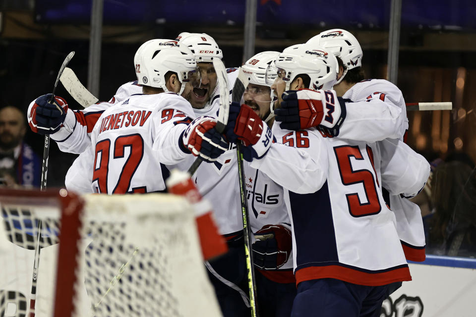 Washington Capitals left wing Marcus Johansson (90) is congratulated for his goal against the New York Rangers during the first period of an NHL hockey game Tuesday, Dec. 27, 2022, in New York. The Capitals won 4-0. (AP Photo/Adam Hunger)