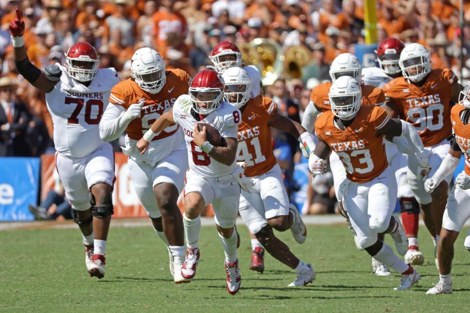 Oklahoma quarterback Dillon Gabriel (8) carries the ball during his team's game against Texas at the Cotton Bowl in Dallas, Saturday, Oct. 7, 2023.