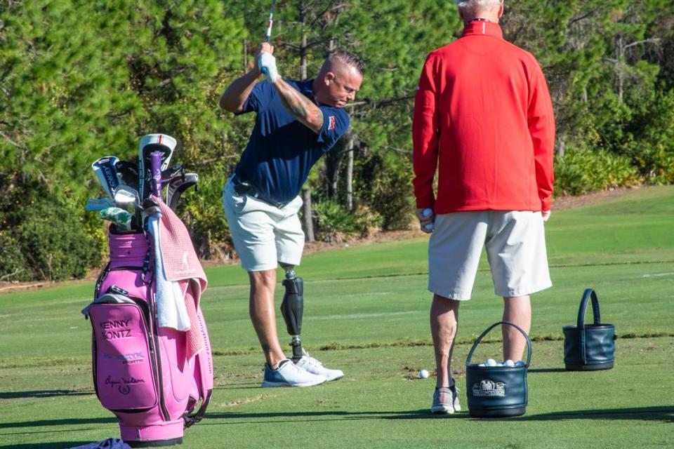 Kenny Bontz of Parrish, hits on the driving range at the Concession Golf Club in Bradenton, warming up for the ISPS Handa All-Abilities Competition.