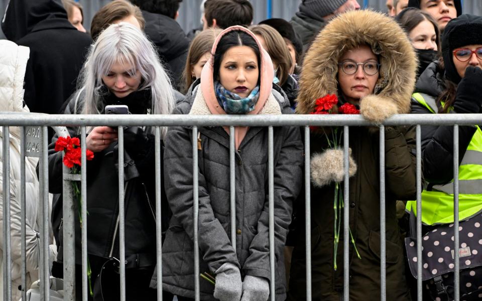 Mourners gather in front of the Mother of God Quench My Sorrows church ahead of a funeral service for Alexei Navalny