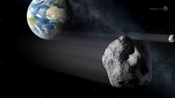 An artist's conception of the Feb. 15 flyby of asteroid 2012 DA14.