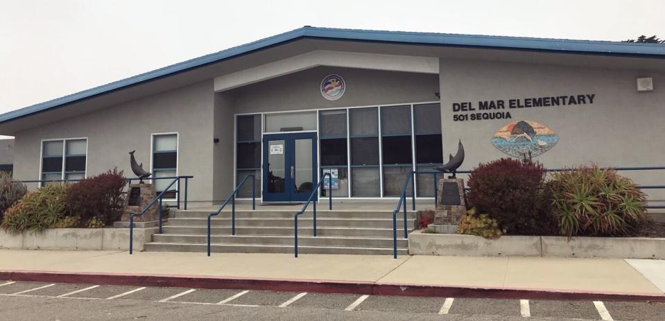 A single-story building bearing the words "Del Mar Elementary"