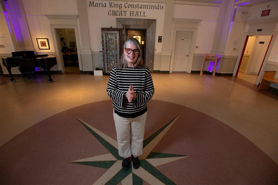 Christine Ernst, the new director of learning at the Cultural Center of Cape Cod in South Yarmouth, stands in the center's Great Hall on April 26. Ernst ran educational programming and outreach for Cotuit Center for the Arts for five years.