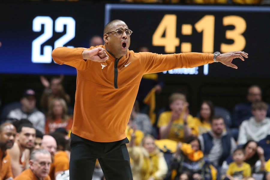 Texas coach Rodney Terry reacts during the first half of an NCAA college basketball game against West Virginia on Saturday, Jan. 13, 2024, in Morgantown, W.Va. (AP Photo/Kathleen Batten)