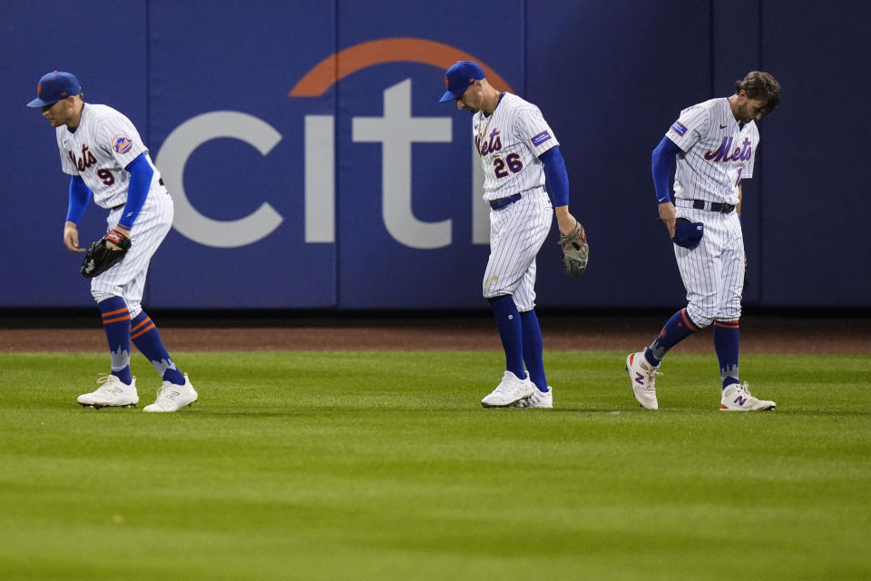 New York Mets' Brandon Nimmo (9) and Jeff McNeil (1) react after Tim Locastro misjudged a ball hit by Pittsburgh Pirates' Bryan Reynolds for an RBI triple during the seventh inning of a baseball game Tuesday, Aug. 15, 2023, in New York. (AP Photo/Frank Franklin II)