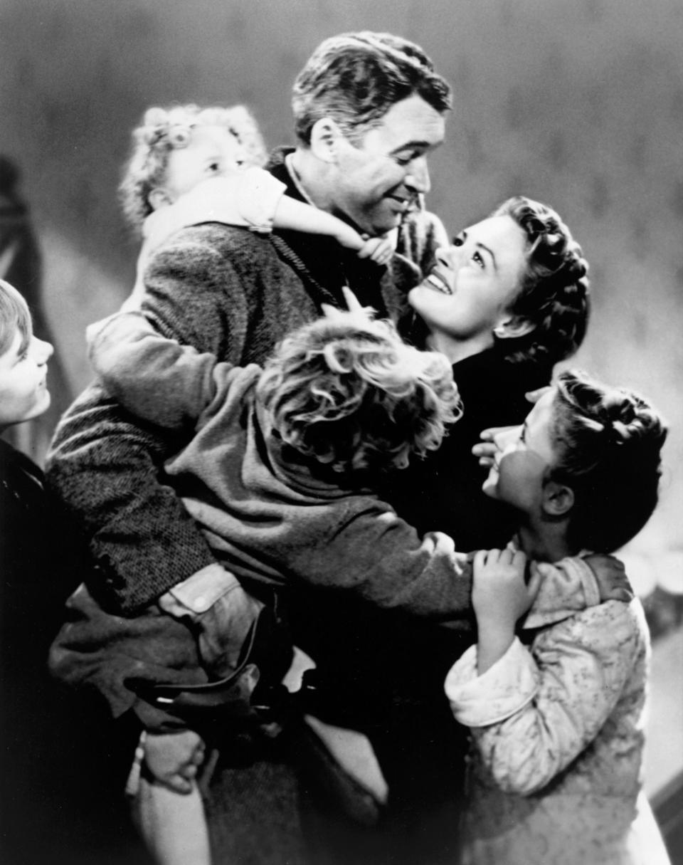 George Bailey (Jimmy Stewart) celebrates Christmas with his wife (Donna Reed) and kids in "It's a Wonderful Life."