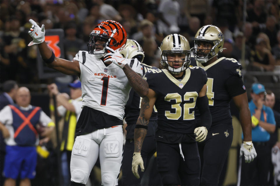 Cincinnati Bengals wide receiver Ja'Marr Chase (1) celebrates a first down against the New Orleans Saints during the first half of an NFL football game in New Orleans, Sunday, Oct. 16, 2022. (AP Photo/Butch Dill)