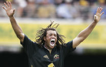 FILE - Australia's Andrew Symonds yells out as he appeals for a lbw decision against England's Jamie Dalrymple in their one day international cricket match in Brisbane, Australia on Jan. 19, 2007. Symonds has died, Saturday, May 14, 2022, after a single-vehicle auto accident near Townsville in northeast Australia. He was 46. (AP Photo/Rick Rycroft, File)