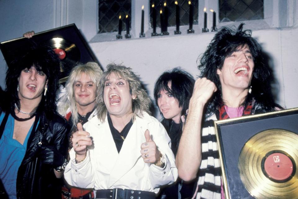 <p>Mötley Crüe and Osbourne met during a sound check in Maine and immediately hit it off—so much so that Osbourne moved into the Crüe's tour bus after meeting. Here they are at the Ozzy Osbourne Concert After-Party at Peter Gatien's Limelight Entertainment Complex in New York City in 1984.</p>