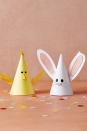 <p>Using craft paper, create hat cones and facial features. Attach feathers for wings and floral wire for whiskers and make bunny ears out of paper and felt. Want a little help? <a href="https://hmg-prod.s3.amazonaws.com/files/wdy040121-template-partyhat-1614369191.pdf?tag=syn-yahoo-20&ascsubtag=%5Bartid%7C10070.g.2893%5Bsrc%7Cyahoo-us" rel="nofollow noopener" target="_blank" data-ylk="slk:Get our hat template;elm:context_link;itc:0;sec:content-canvas" class="link ">Get our hat template</a>.</p>