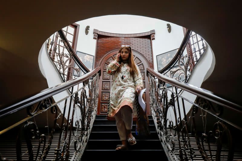 Dananeer Mobeen, a social media influencer who has become famous after her five-second video went viral, descends a staircase in Karachi, Pakistan