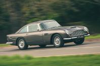 <p>Shaken, not stirred – need we say anymore? The DB5 is often billed as the “most famous car in the world”. It was stunning in every way, but when mated with browning machine guns, battering rams, smoke screens and other<strong> gadgets </strong>for James Bond Goldfinger, people fell head over heels.</p><p>The DB4 sold well, but Aston Martin needed something new to keep up with strong competition. The DB5 was soon born, and many flocked to see it. Celebrities threw their cash at Aston Martin to get one of the <strong>1022 </strong>cars on offer. Overall, there were<strong> 887 </strong>coupes, <strong>123</strong> convertibles and <strong>12</strong> bespoke shooting brakes made.</p>