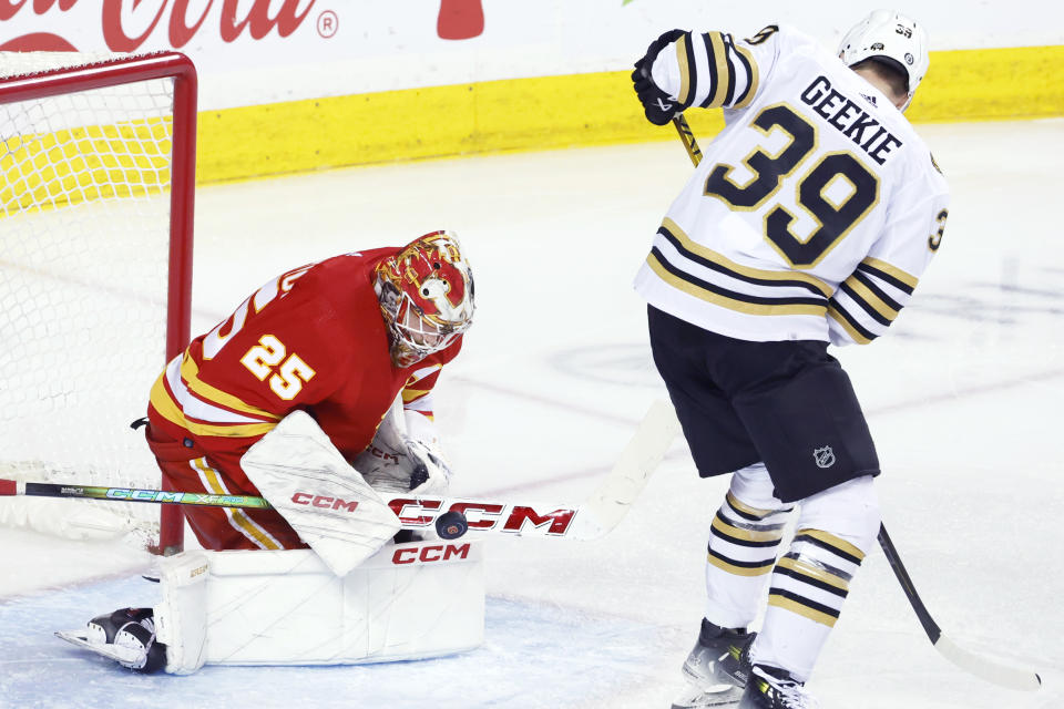 Boston Bruins' Morgan Geekie is stopped by Calgary Flames goalie Jacob Markstrom during the second period of an NHL hockey game Thursday, Feb. 22, 2024, in Calgary, Alberta. (Larry MacDougal/The Canadian Press via AP)