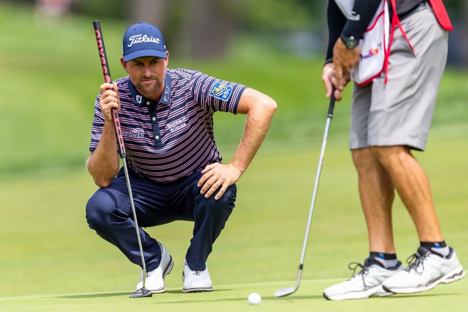 Webb Simpson looks over a putt on the ninth hole on July 28 during the Rocket Mortgage Classic in Detroit.