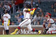 Atlanta Braves Ronald Acuna Jr. hits a sacrifice fly in the sixth inning of a baseball game against the Philadelphia Phillies, Tuesday, May 24, 2022, in Atlanta. (AP Photo/Todd Kirkland)