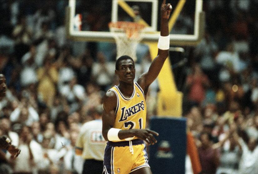 Laker forward Michael Cooper raises his finger to signify the Lakers are #1 at the end of the game 6/4. Cooper threw in 6 three point baskets in 7 tries.