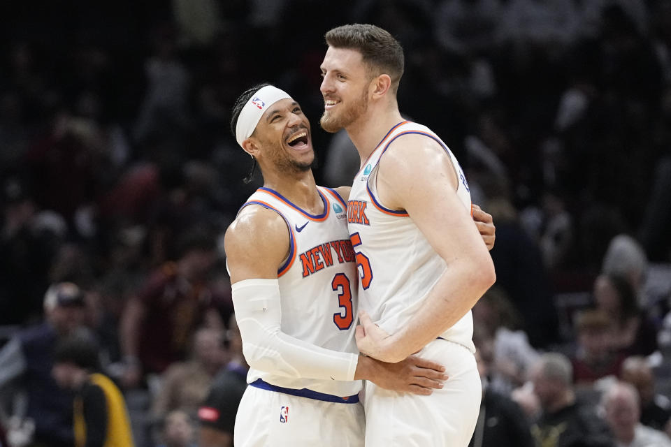 New York Knicks guard Josh Hart (3) and center Isaiah Hartenstein, right, celebrate as the Knicks defeat the Cleveland Cavaliers in an NBA basketball game, Sunday, March 3, 2024, in Cleveland. (AP Photo/Sue Ogrocki)