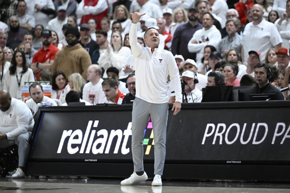 Texas Tech head coach Grant McCasland signals to players during the first half of an NCAA college basketball game against Kansas, Monday, Feb. 12, 2024, in Lubbock, Texas. (AP Photo/Justin Rex)