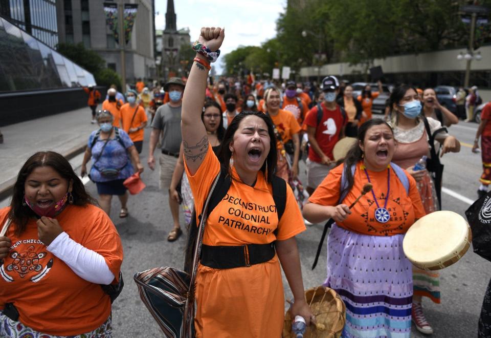 <span class="caption">People march in Ottawa during a rally to demand an independent investigation into Canada's crimes against Indigenous Peoples, including those at Indian Residential Schools on July 31, 2021. </span> <span class="attribution"><span class="source">THE CANADIAN PRESS/Justin Tang</span></span>