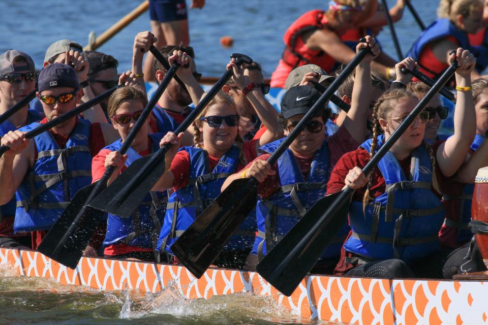 One of dozens of Dragon Boat Teams competes for speed and money raised during the annual KARM Dragon Boat Festival held at the Cove at Concord Park on June 17, 2023.