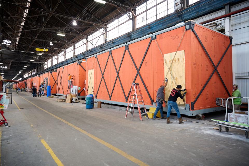 Workers assemble a portion of the Helena Montana Temple at the 50-acre BLOX facility in Bessemer, Alabama.