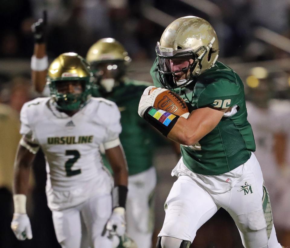 STVM running back George Linberger rushes into the end zone to score during the second half of a high school football game against Youngstown Ursuline, Friday, Oct. 1, 2021, in Akron, Ohio.