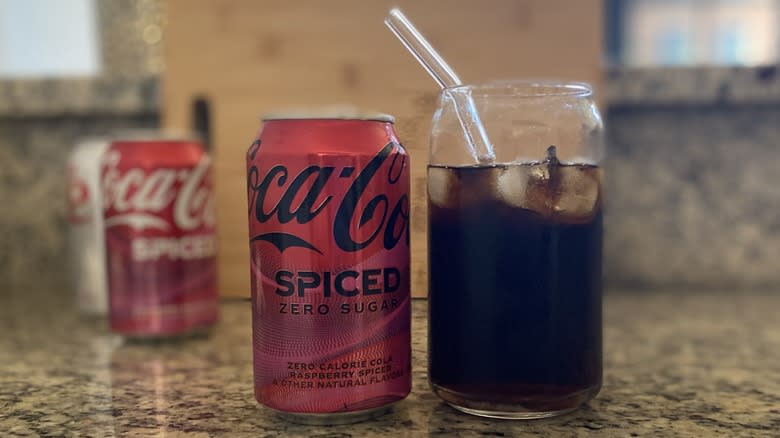 Coke Spiced in glass with straw