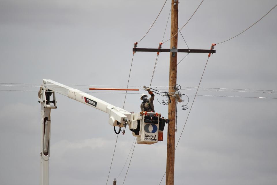 Xcel Energy crews work to restore power after a severe thunderstorm early Wednesday, May 29, 2024, north of Tahoka.