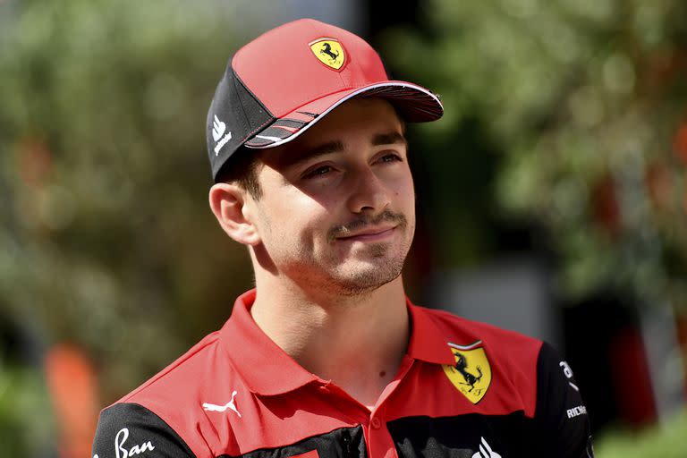 Ferrari driver Charles Leclerc of Monaco walks through peddock at the Hungaroring racetrack in Mogyorod, near Budapest, Hungary, Thursday, July 28, 2022. The Hungarian Formula One Grand Prix will be held on Sunday. (AP Photo/Anna Szilagyi)