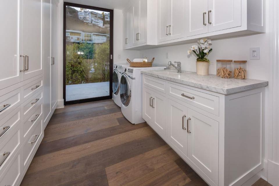 <p>The laundry room. There’s a balcony where you can hang clothes to air-dry if you like, Marcus said. (Photo: <a href="http://bit.ly/1UCMKf2" rel="nofollow noopener" target="_blank" data-ylk="slk:Sotheby’s International Realty via Catherine Marcus;elm:context_link;itc:0;sec:content-canvas" class="link ">Sotheby’s International Realty via Catherine Marcus</a>, shot by Mark Lee)</p>