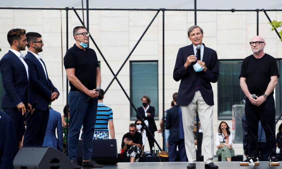 The scientific director of Humanitas, Alberto Mantovani, with Italian designers Domenico Dolce and Stefano Gabbana at the their show on 15 July.