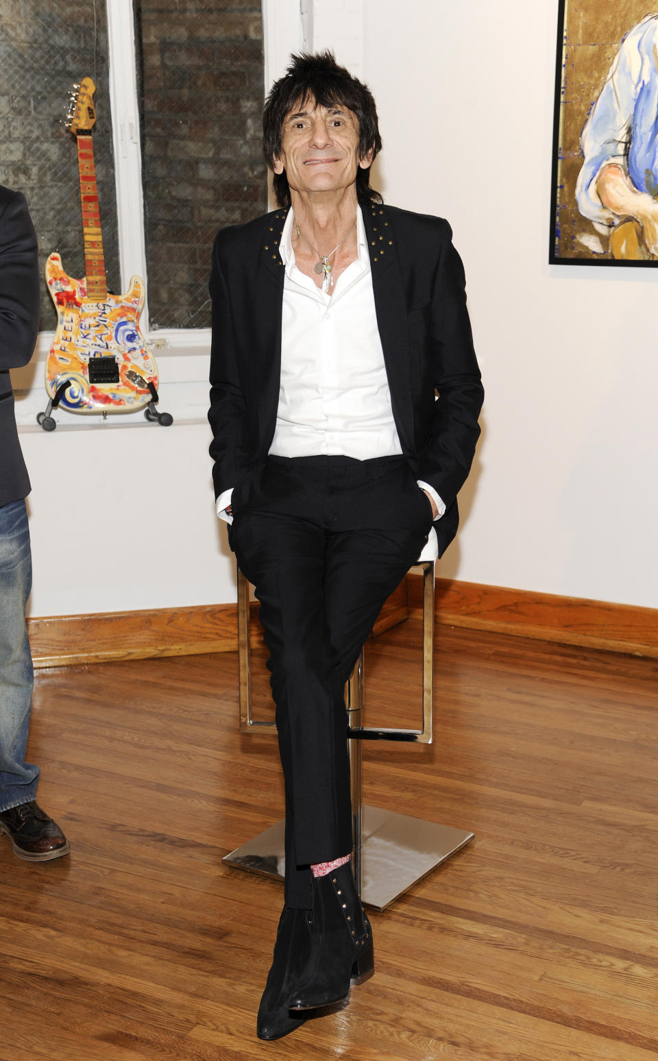 Rolling Stones guitarist Ronnie Wood appears during a news conference unveiling his new art exhibit "Faces, Time and Places" on Monday, April 9, 2012, in New York. (AP Photo/Evan Agostini)