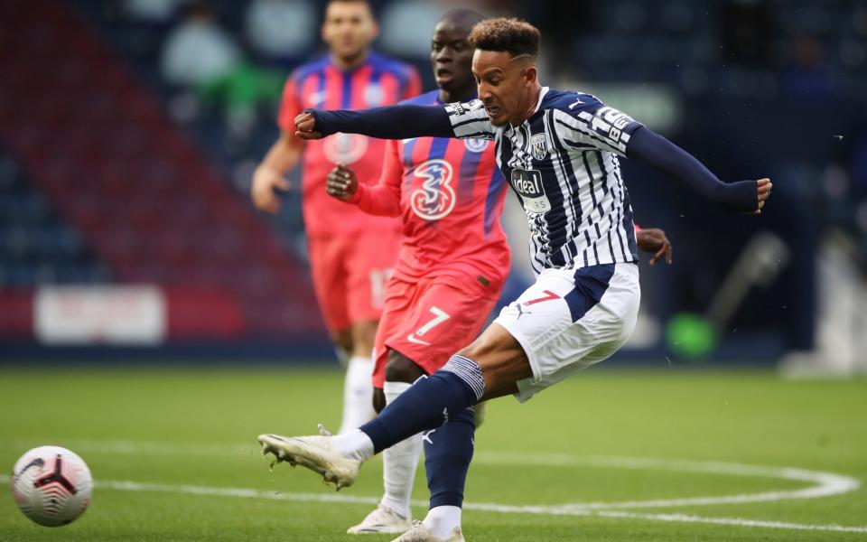 West Bromwich Albion's English striker Callum Robinson shoots to score the opening goal of the English Premier League football match between West Bromwich Albion and Chelsea  - AFP