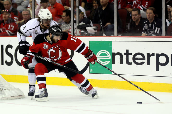 NEWARK, NJ - JUNE 09: Stephen Gionta #11 of the New Jersey Devils goes for a loose puck against Anze Kopitar #11 of the Los Angeles Kings during Game Five of the 2012 NHL Stanley Cup Final at the Prudential Center on June 9, 2012 in Newark, New Jersey. (Photo by Elsa/Getty Images)